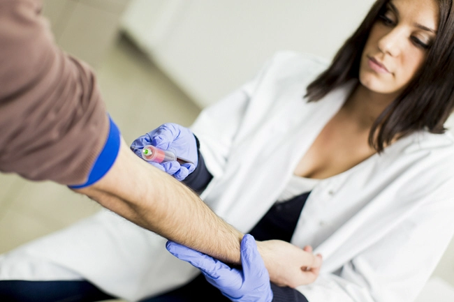 female doctor takes blood sample 2103
