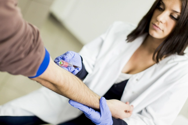female doctor takes blood sample 2103 female doctor takes blood sample 2103