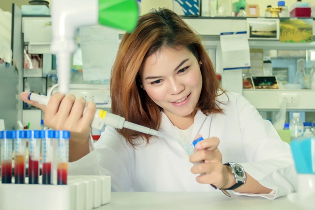 female doing blood analysis in lab