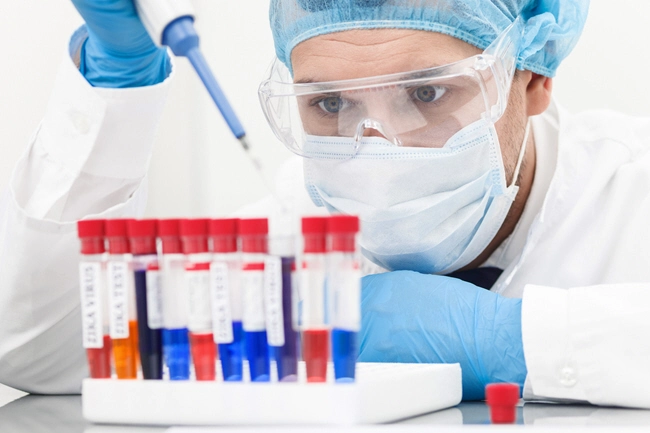 male doctor analyzes blood sample in lab male doctor analyzes blood sample in lab