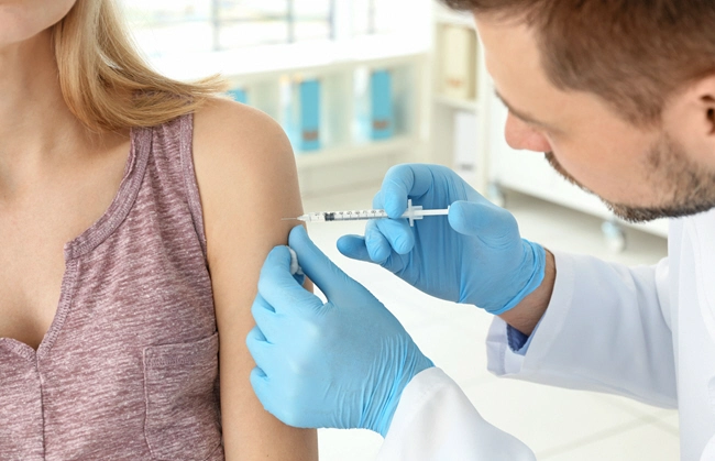 male doctor blood test of young woman male doctor blood test of young woman