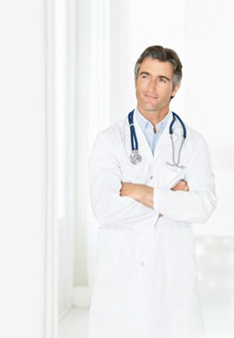 contemplative male doctor looking at copyspace in corridor xs contemplative male doctor looking at copyspace in corridor xs