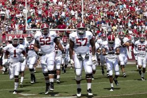 football team takes the field 300x200