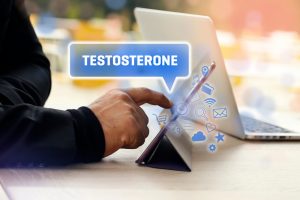 Pointing at testosterone symbol on laptop 300x200