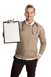 a handsome testosterone surgeon with a stethoscope around his neck holding a clipboard and smiling 200x300