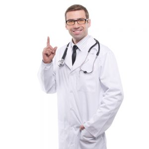 smiling male doctor in white coat pointing finger up isolated 260349455 300x300