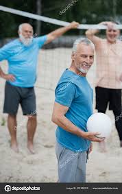 three men at the vollyball court