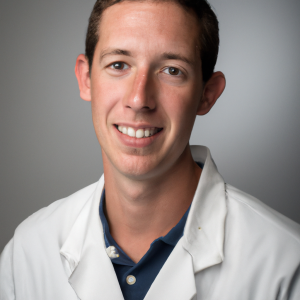 a professional and visually appealing image of a young happy smiling caucasian doctor with white teeth