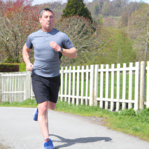 a professional appealing image of a caucasian man or woman jogging on a sunny day