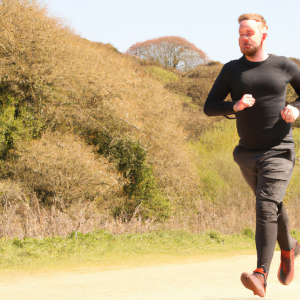 a professional appealing image of a caucasian man or woman jogging on a sunny day