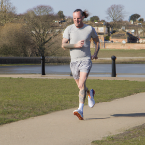 a professional appealing image of a caucasian man or woman jogging on a sunny day