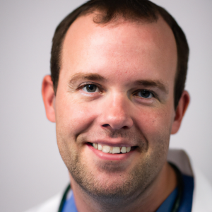 a professional and visually appealing image of a young happy smiling caucasian doctor with white teeth